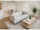 Virtually staged living room with cozy seating area and dining table showcasing an inviting space at 6908 Dorita Ave # 101, Las Vegas, NV 89108