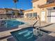 Community pool and spa area with lounge chairs and showers at 6908 Dorita Ave # 101, Las Vegas, NV 89108