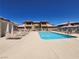 Beautiful community pool with plenty of lounge chairs for relaxing in the sun at 6908 Dorita Ave # 101, Las Vegas, NV 89108