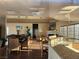 Spacious recreation room with dining area, fireplace, and wet bar at 6908 Dorita Ave # 101, Las Vegas, NV 89108