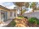 Spacious backyard with block wall, mature trees, and low-maintenance landscaping at 7617 Sea Cliff Way, Las Vegas, NV 89128