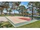 Community basketball court, lake, picnic tables, and treed area at 7617 Sea Cliff Way, Las Vegas, NV 89128