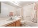 Bright bathroom features a shower over bath, and neutrally decorated sink and counter at 7617 Sea Cliff Way, Las Vegas, NV 89128
