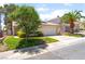 Charming single-story home features a well-manicured lawn and a two-car garage at 7617 Sea Cliff Way, Las Vegas, NV 89128