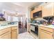 View of the kitchen area looking towards the breakfast nook and dining room at 7617 Sea Cliff Way, Las Vegas, NV 89128