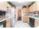 Functional kitchen with tile countertops and ample cabinet space at 7617 Sea Cliff Way, Las Vegas, NV 89128
