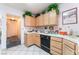 Functional kitchen with tile countertops and ample cabinet space at 7617 Sea Cliff Way, Las Vegas, NV 89128