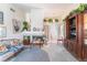 Inviting living room with fireplace, vaulted ceilings, blue carpet, and natural light at 7617 Sea Cliff Way, Las Vegas, NV 89128