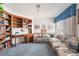 Cozy den with custom built in shelves, comfortable seating, and natural light at 7617 Sea Cliff Way, Las Vegas, NV 89128