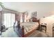 Spacious main bedroom features large furniture, carpet and sliding door at 7617 Sea Cliff Way, Las Vegas, NV 89128