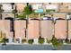 Aerial view showcasing neighborhood street with desert landscaping, pools, and multiple single-Gathering homes at 7755 Pacific Rim Ct, Las Vegas, NV 89139