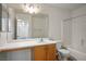 Bright bathroom featuring a large mirror and full bathtub with shower at 7755 Pacific Rim Ct, Las Vegas, NV 89139