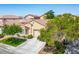 Single story home with desert landscaping and a tile roof at 7755 Pacific Rim Ct, Las Vegas, NV 89139