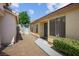 Side exterior featuring a well-maintained walkway and gate access to the backyard at 7755 Pacific Rim Ct, Las Vegas, NV 89139