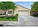 Charming single-story home featuring a two-car garage and well-maintained front yard at 7755 Pacific Rim Ct, Las Vegas, NV 89139