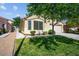 Single-story home with mature landscaping and a welcoming front yard, offering great curb appeal at 7755 Pacific Rim Ct, Las Vegas, NV 89139