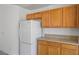 Kitchen featuring cabinets and a white refrigerator, offering functionality and storage at 7755 Pacific Rim Ct, Las Vegas, NV 89139