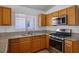 Kitchen featuring stainless steel appliances, including a gas range and granite countertops at 7755 Pacific Rim Ct, Las Vegas, NV 89139