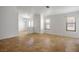 Bright living room features tile floors, neutral walls, large windows, and a modern light fixture at 7755 Pacific Rim Ct, Las Vegas, NV 89139