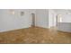 Spacious room with tile floors, neutral walls, high ceilings, and arched doorways at 7755 Pacific Rim Ct, Las Vegas, NV 89139