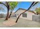 Backyard featuring desert landscaping, block wall and trees at 7949 Long Beach St, Las Vegas, NV 89139