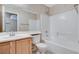 Bathroom with a white vanity, large mirror, and shower over tub at 7949 Long Beach St, Las Vegas, NV 89139