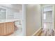 View into the bathroom with a single vanity and shower-tub combo at 7949 Long Beach St, Las Vegas, NV 89139