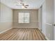 Bright bedroom featuring wood-look floors, neutral walls, and ample closet space at 7949 Long Beach St, Las Vegas, NV 89139