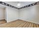 Empty bedroom with a ceiling fan, wood-look flooring, and door leading to the hallway at 7949 Long Beach St, Las Vegas, NV 89139