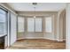 Bright breakfast nook with large windows, neutral walls, and wood-look flooring at 7949 Long Beach St, Las Vegas, NV 89139