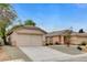 A beautiful single-story home with a two-car garage and low-maintenance desert landscaping at 7949 Long Beach St, Las Vegas, NV 89139