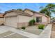 A single-story home with a two-car garage and easy-to-maintain desert landscaping at 7949 Long Beach St, Las Vegas, NV 89139