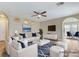 Bright, staged living room showcasing archways, recessed lighting, and an open floor plan at 7949 Long Beach St, Las Vegas, NV 89139