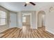 Open-concept living room featuring wood-look floors, neutral paint, and natural light at 7949 Long Beach St, Las Vegas, NV 89139