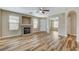 A spacious living room with a fireplace, wood-look floors, and an open layout at 7949 Long Beach St, Las Vegas, NV 89139