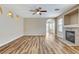 Spacious living room with fireplace, arched doorways, neutral walls, and wood-look flooring at 7949 Long Beach St, Las Vegas, NV 89139