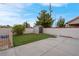 A charming backyard features a storage shed, low-maintenance artificial turf, and a block fence at 8024 Hackberry Dr, Las Vegas, NV 89123
