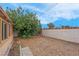 Backyard featuring desert landscaping, a covered patio, and block fence at 8024 Hackberry Dr, Las Vegas, NV 89123