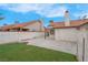 Backyard featuring a concrete patio, low-maintenance artificial turf, and a block fence at 8024 Hackberry Dr, Las Vegas, NV 89123