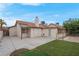 Backyard featuring a concrete patio, low-maintenance artificial turf, and a block fence at 8024 Hackberry Dr, Las Vegas, NV 89123