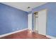 This bedroom features blue textured walls and a closet with sliding doors at 8024 Hackberry Dr, Las Vegas, NV 89123