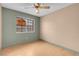 The bedroom has hardwood floors, paint on the walls, and a ceiling fan at 8024 Hackberry Dr, Las Vegas, NV 89123