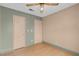 Bedroom with painted walls, and two closets with doors and hard wood floors at 8024 Hackberry Dr, Las Vegas, NV 89123