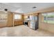 A bright kitchen with tiled flooring, light-colored cabinetry, and stainless steel appliances at 8024 Hackberry Dr, Las Vegas, NV 89123