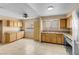 An eat-in kitchen space, featuring tiled floors, light-colored cabinets, and natural light at 8024 Hackberry Dr, Las Vegas, NV 89123