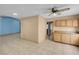 Kitchen featuring tile flooring, wood cabinets, access to other rooms, and natural light at 8024 Hackberry Dr, Las Vegas, NV 89123