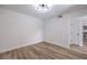 Neutral bedroom with hardwood floors and a modern light fixture at 8101 W Flamingo Rd # 1035, Las Vegas, NV 89147