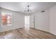Bedroom featuring wood-look floors, a window, and white walls at 8101 W Flamingo Rd # 1035, Las Vegas, NV 89147