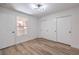 Bedroom with wood-look flooring and closet with sliding doors at 8101 W Flamingo Rd # 1035, Las Vegas, NV 89147