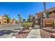 Community entrance with desert landscaping, palm trees and building address number at 8101 W Flamingo Rd # 1035, Las Vegas, NV 89147